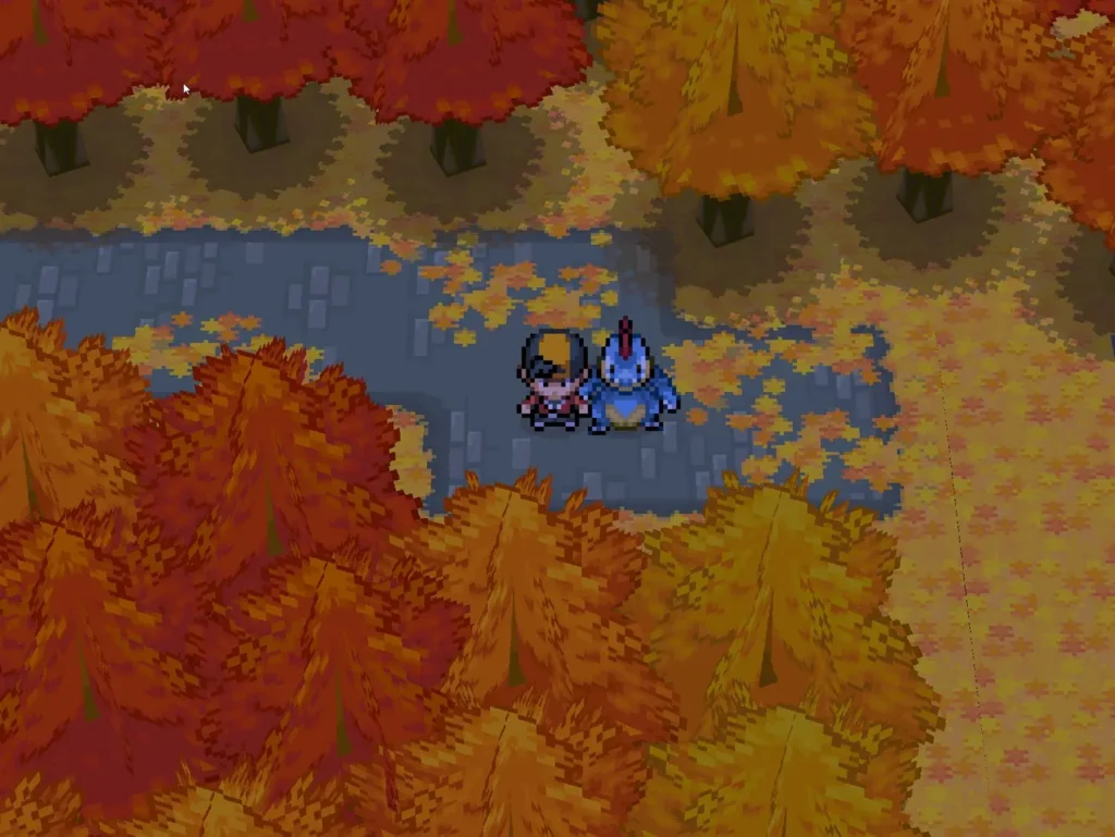 Pokemon ChromeGold screenshot showing the trainer with a Totodile follower in an autumn forest area.